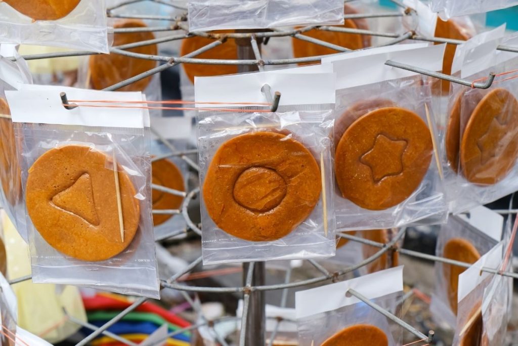 Dalgona or Ppopgi individually packaged in a South Korean candy store via Freedom to Wander